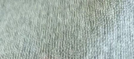 A feature on non-woven adhesive interlining